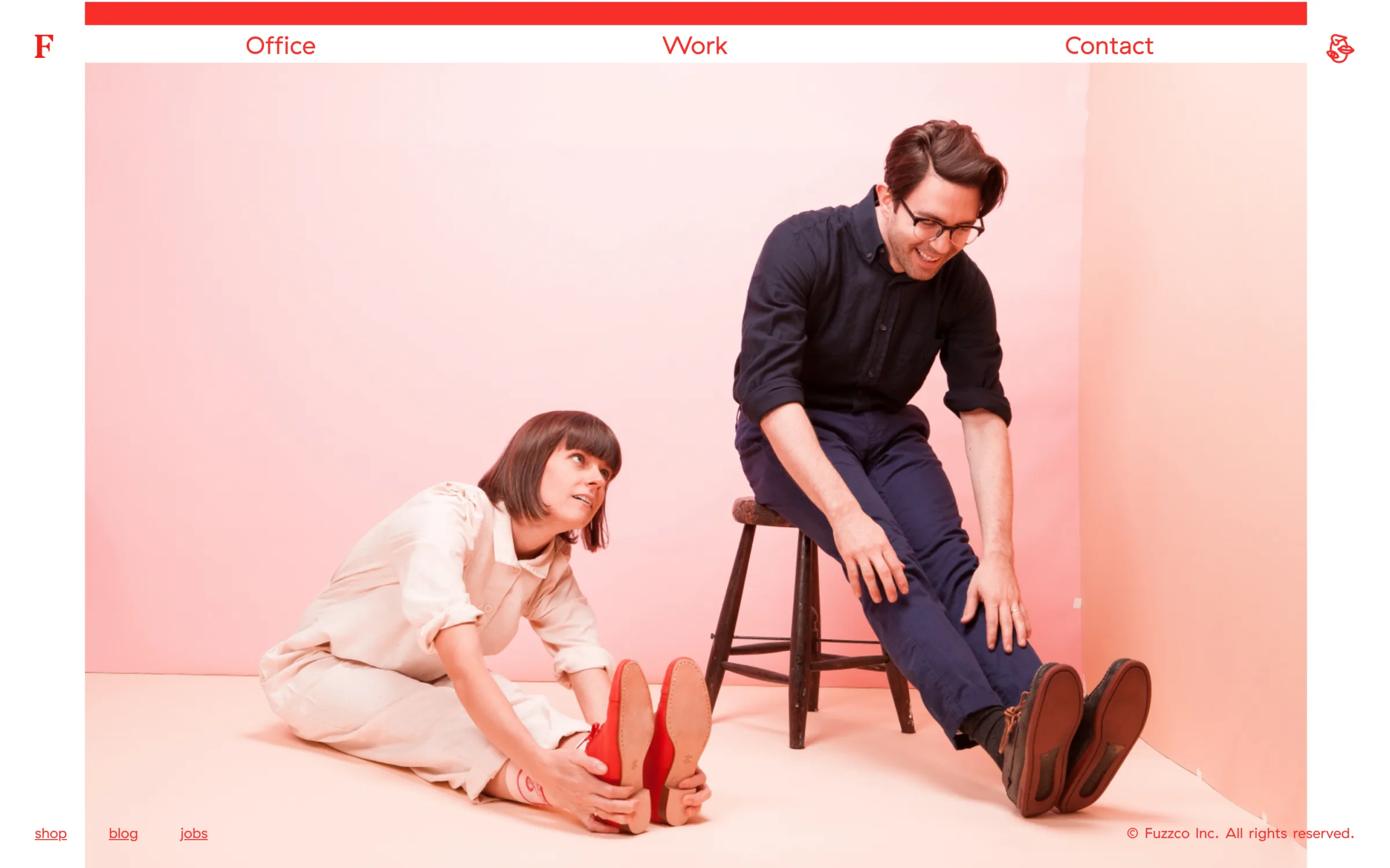 Fuzzco.com’s homepage: a red bar, the Office, Work and Contact navigation, and a full-width studio photo.
